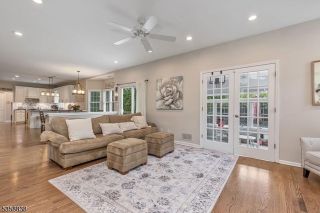 411 Arlington Ave, South Plainfield Boro, NJ 07080 - living room with wood finished floors, recessed lighting, ceiling fan, french doors, and baseboards