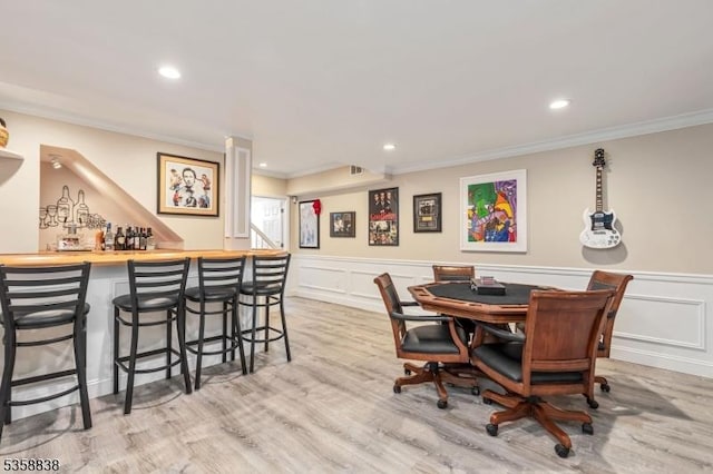 411 Arlington Ave, South Plainfield Boro, NJ 07080 - dining room featuring ornamental molding, a bar, wood finished floors, a decorative wall, and recessed lighting