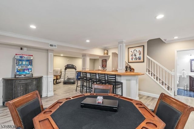 411 Arlington Ave, South Plainfield Boro, NJ 07080 - dining area with stairs, crown molding, light wood-style floors, recessed lighting, and a community bar