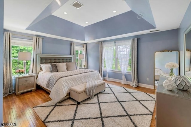 1364 Springfield Ave, New Providence Boro, NJ 07974 - bedroom with a raised ceiling and light wood-style flooring