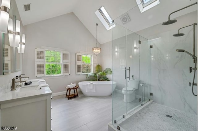 1364 Springfield Ave, New Providence Boro, NJ 07974 - full bathroom featuring a skylight, a marble finish shower, vanity, a freestanding tub, and high vaulted ceiling