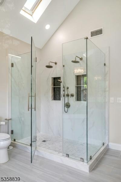 1364 Springfield Ave, New Providence Boro, NJ 07974 - full bath with lofted ceiling, a skylight, and a marble finish shower