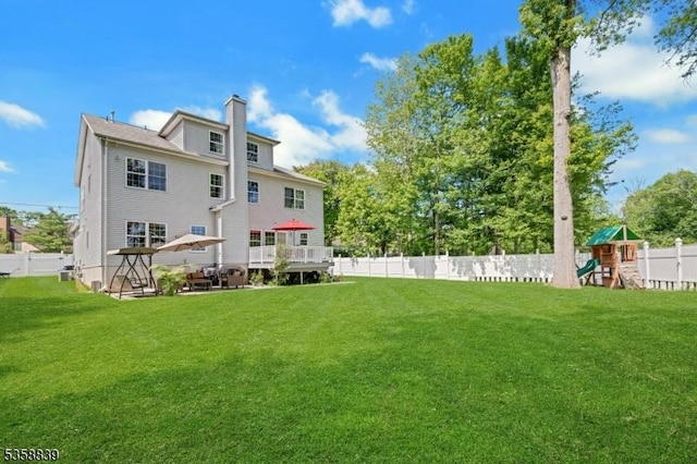 1364 Springfield Ave, New Providence Boro, NJ 07974 - rear view of house featuring a playground, a fenced backyard, and a chimney