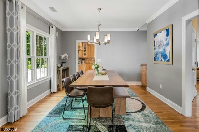 1364 Springfield Ave, New Providence Boro, NJ 07974 - dining space with a chandelier, ornamental molding, and light wood finished floors