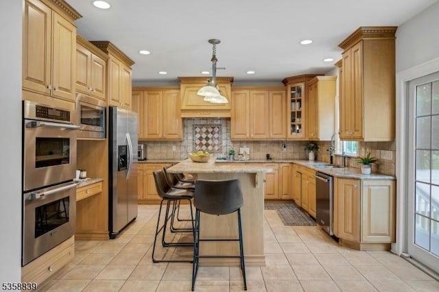 1364 Springfield Ave, New Providence Boro, NJ 07974 - kitchen featuring appliances with stainless steel finishes, healthy amount of natural light, a breakfast bar area, light tile patterned flooring, and recessed lighting