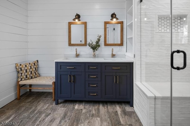6 Ironia Rd, Chester Twp, NJ 07836 - bathroom with double vanity, a stall shower, and wood finished floors