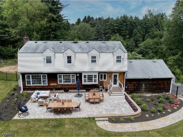 6 Ironia Rd, Chester Twp, NJ 07836 - back of property with an outdoor hangout area, a patio area, a forest view, and a chimney