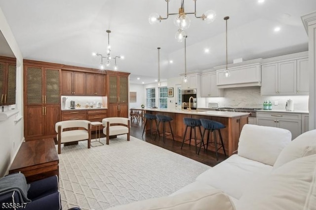 47 Barnsdale Rd, Millburn Twp, NJ 07078 - living area with wood finished floors, a chandelier, recessed lighting, and high vaulted ceiling