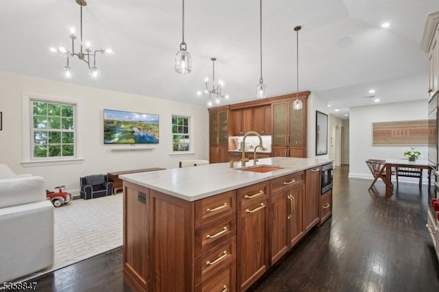 47 Barnsdale Rd, Millburn Twp, NJ 07078 - kitchen featuring a chandelier, vaulted ceiling, open floor plan, light countertops, and a sink