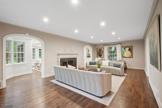 47 Barnsdale Rd, Millburn Twp, NJ 07078 - living room with dark wood-style floors, arched walkways, baseboards, recessed lighting, and a fireplace
