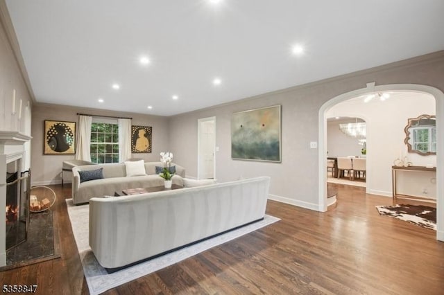 47 Barnsdale Rd, Millburn Twp, NJ 07078 - living area featuring arched walkways, crown molding, wood finished floors, recessed lighting, and baseboards