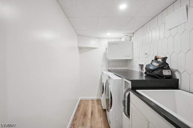 47 Barnsdale Rd, Millburn Twp, NJ 07078 - washroom with washer and clothes dryer, light wood finished floors, baseboards, recessed lighting, and cabinet space