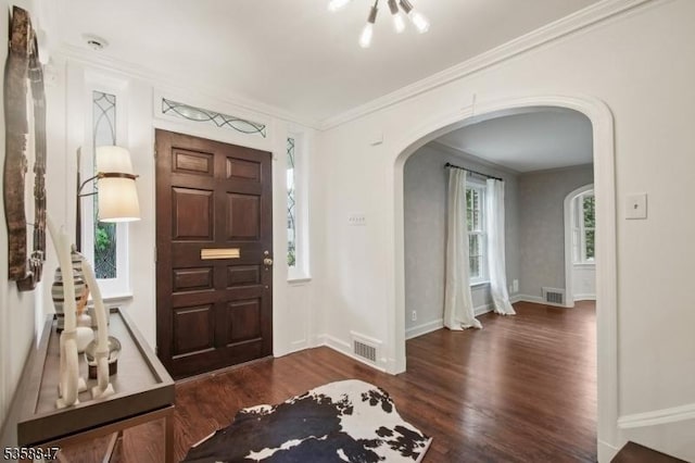 47 Barnsdale Rd, Millburn Twp, NJ 07078 - foyer featuring arched walkways, wood finished floors, ornamental molding, and baseboards