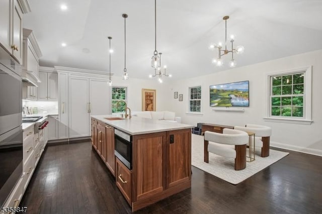 47 Barnsdale Rd, Millburn Twp, NJ 07078 - kitchen featuring vaulted ceiling, appliances with stainless steel finishes, a chandelier, light countertops, and plenty of natural light