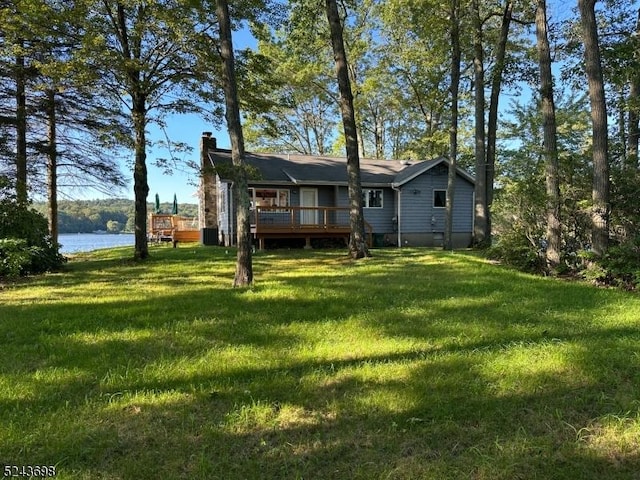 120 Island Rd, Vernon Twp, NJ 07422 - rear view of house with a deck with water view, a lawn, and a chimney