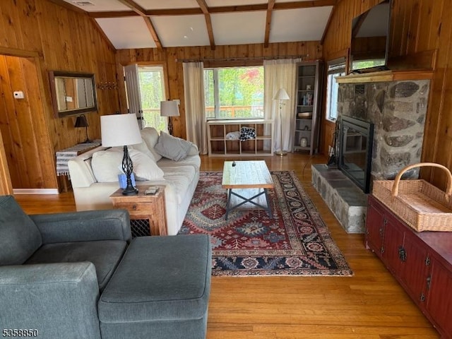 120 Island Rd, Vernon Twp, NJ 07422 - living room featuring wood walls, light wood-style flooring, and a fireplace