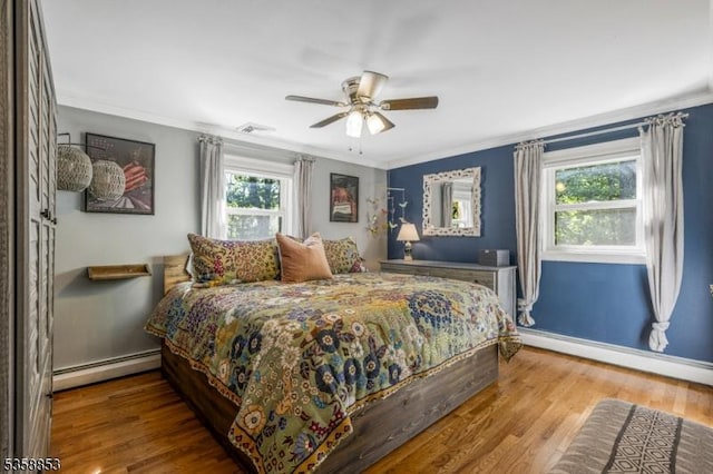 439 Mountain View Rd, Franklin Twp, NJ 08802 - bedroom featuring a baseboard heating unit, ornamental molding, wood finished floors, baseboards, and ceiling fan