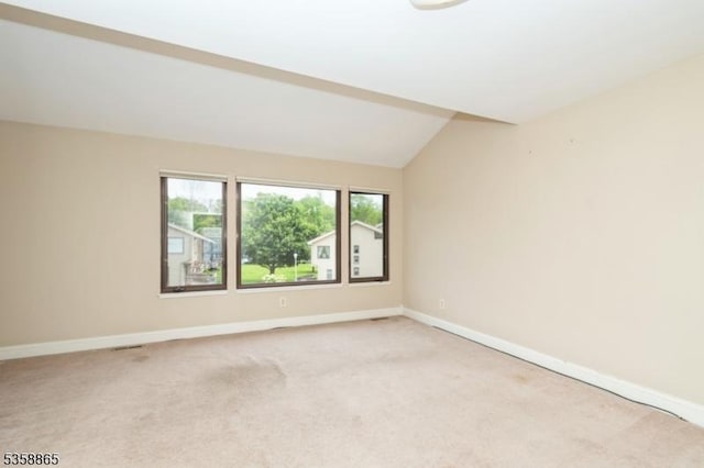 182 Dakota Dr, Andover Twp, NJ 07848 - unfurnished room featuring baseboards, light carpet, and lofted ceiling