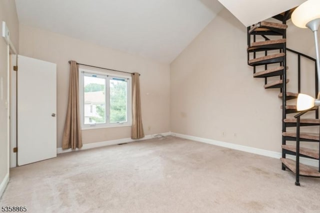 182 Dakota Dr, Andover Twp, NJ 07848 - unfurnished living room with carpet floors, stairway, baseboards, and lofted ceiling