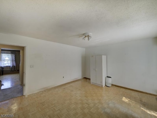 1068 Robin Rd, Hillsborough Twp, NJ 08844 - unfurnished room featuring a textured ceiling