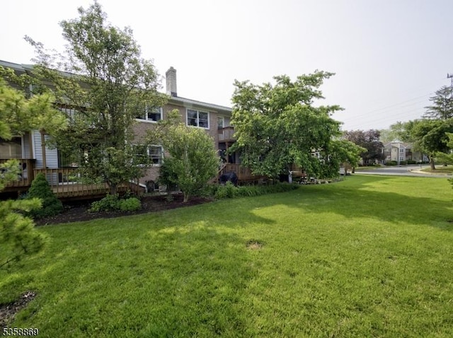 1068 Robin Rd, Hillsborough Twp, NJ 08844 - view of grassy yard with a wooden deck