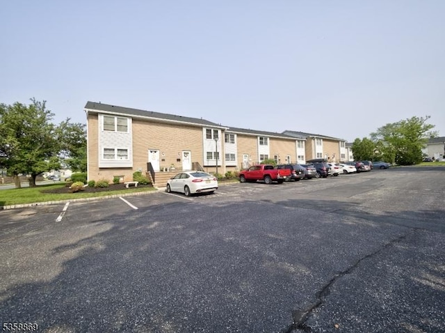 1068 Robin Rd, Hillsborough Twp, NJ 08844 - view of building exterior with uncovered parking and a residential view