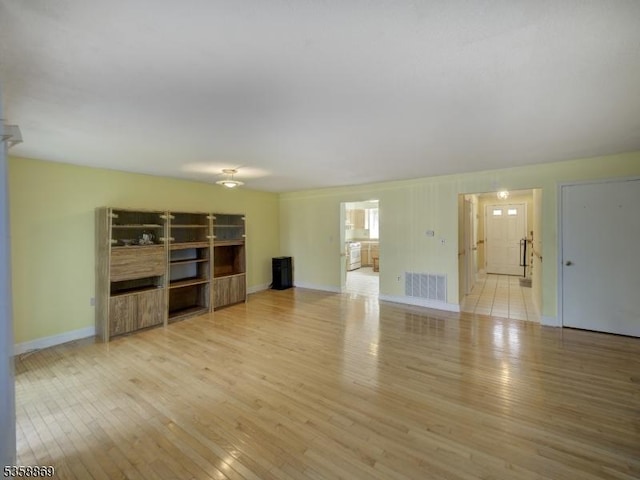 1068 Robin Rd, Hillsborough Twp, NJ 08844 - unfurnished living room featuring light wood finished floors and baseboards