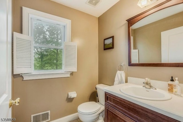 221 Sussex Ave, Andover Twp, NJ 07860 - bathroom featuring toilet, healthy amount of natural light, vanity, and baseboards