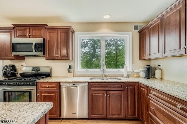 221 Sussex Ave, Andover Twp, NJ 07860 - kitchen with appliances with stainless steel finishes, a sink, light stone countertops, and recessed lighting