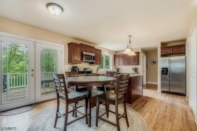 221 Sussex Ave, Andover Twp, NJ 07860 - dining space with french doors, light wood-style floors, and baseboards