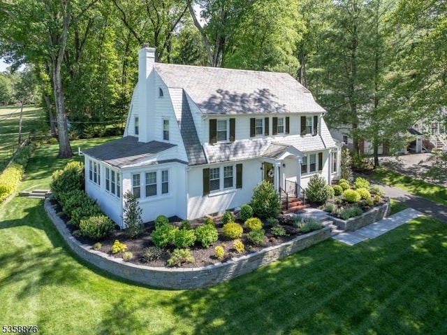 1 Spring Brook Rd, Morris Twp, NJ 07960 - view of front of property featuring a chimney, a front lawn, and a gambrel roof