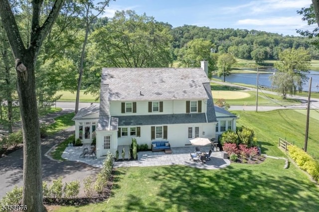 1 Spring Brook Rd, Morris Twp, NJ 07960 - rear view of property with a patio, a water view, a lawn, and french doors