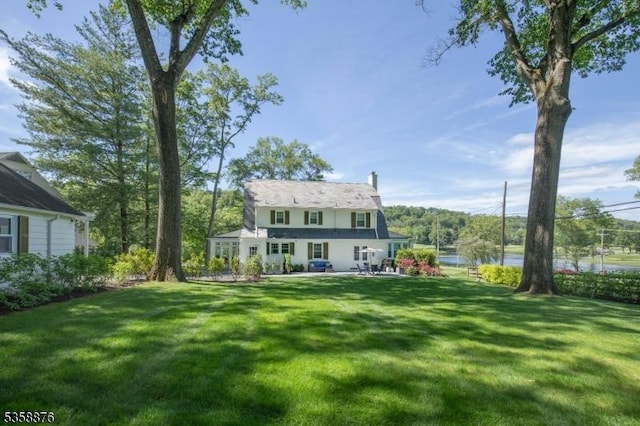 1 Spring Brook Rd, Morris Twp, NJ 07960 - rear view of property featuring a yard, a patio, and a water view