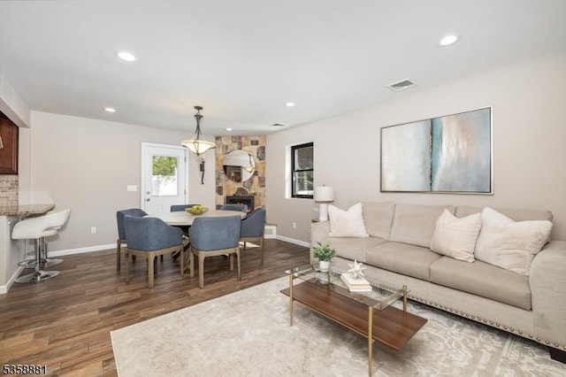 74-76 Watsessing Ave, Belleville Twp, NJ 07109 - living area with wood finished floors, baseboards, recessed lighting, and a stone fireplace