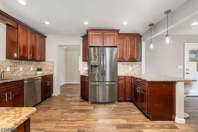 74-76 Watsessing Ave, Belleville Twp, NJ 07109 - kitchen with appliances with stainless steel finishes, a peninsula, light wood-type flooring, tasteful backsplash, and recessed lighting