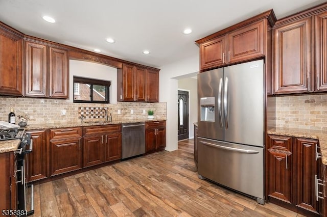 74-76 Watsessing Ave, Belleville Twp, NJ 07109 - kitchen featuring stainless steel appliances, a sink, wood finished floors, tasteful backsplash, and recessed lighting