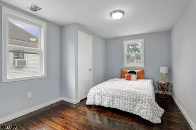 39 Emma St, Plainfield City, NJ 07063 - bedroom with dark wood-style flooring and baseboards