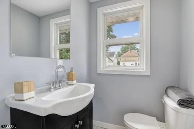39 Emma St, Plainfield City, NJ 07063 - bathroom featuring toilet, plenty of natural light, vanity, and baseboards