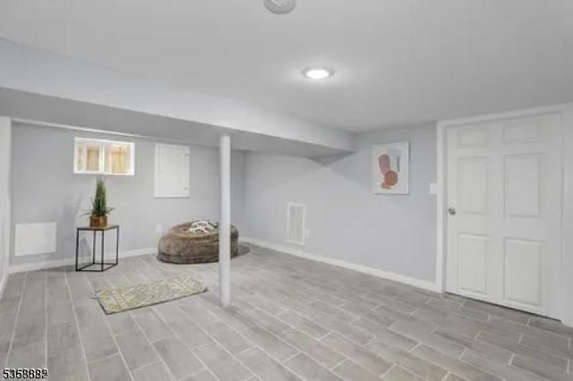 39 Emma St, Plainfield City, NJ 07063 - basement with baseboards and wood finished floors