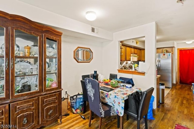 dining space featuring wood finished floors
