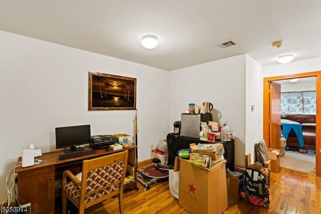 office area with wood finished floors