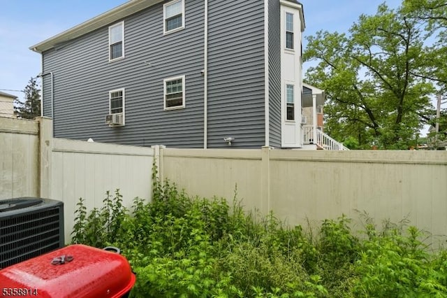 view of home's exterior with cooling unit