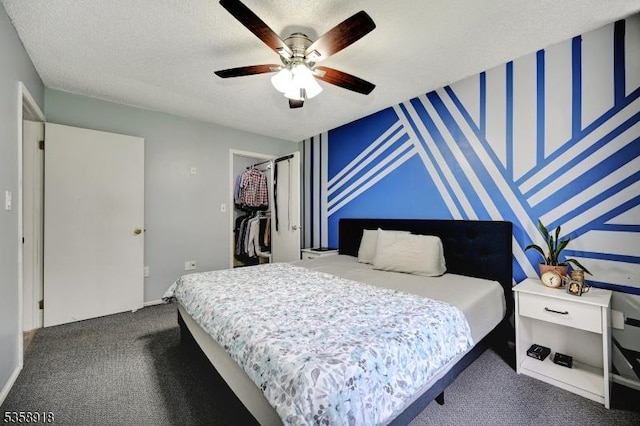 62 Taylor Dr, Franklin Twp, NJ 08823 - bedroom with dark colored carpet, a walk in closet, a ceiling fan, a closet, and a textured ceiling