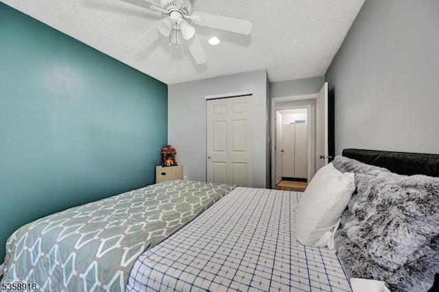 62 Taylor Dr, Franklin Twp, NJ 08823 - bedroom featuring a closet, a ceiling fan, and a textured ceiling