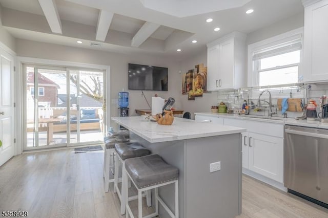118 Holly St, Woodbridge Twp, NJ 07064 - kitchen with stainless steel dishwasher, light wood finished floors, recessed lighting, a sink, and a kitchen island