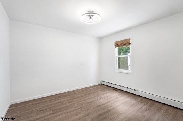3 Raritan Ave, Roxbury Twp, NJ 07852 - unfurnished room with a baseboard radiator, wood finished floors, and baseboards