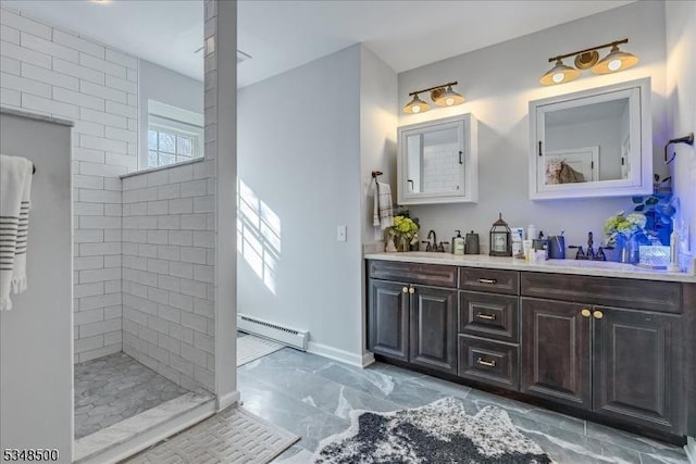 full bathroom with a baseboard heating unit, double vanity, a walk in shower, and marble finish flooring