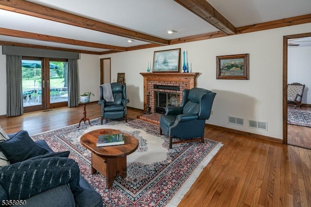 434 Bellemead Griggstown Rd, Montgomery Twp, NJ 08502 - living room with beamed ceiling, a fireplace, baseboards, and hardwood / wood-style flooring
