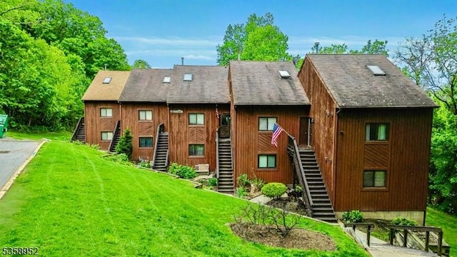 1 Red Lodge Dr Unit 5, Vernon Twp, NJ 07462 - back of house with stairs and a yard