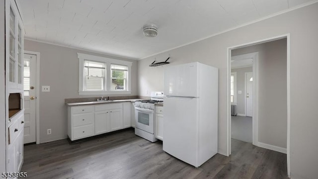 118 S 7th Ave, Manville Boro, NJ 08835 - kitchen featuring white appliances, dark wood-type flooring, white cabinets, a sink, and crown molding